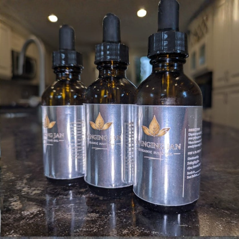 Swinging Jan Organic Hair Oil bottles